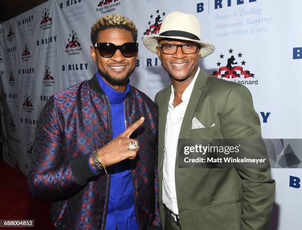 Singer/songwriter Usher and comedian/actor Tommy Davidson attend the B. Riley & Co. 8th Annual "Big Fighters, Big Cause" Charity Boxing Night...