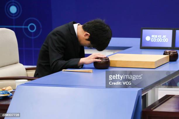 The World's top human player Ke Jie competes against Google's artificial intelligence program AlphaGo during the second round match of Google...
