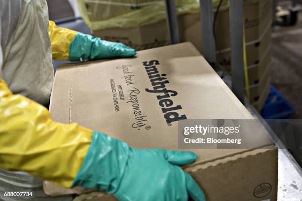 The Smithfield Foods Inc. Logo is displayed on a box at the company's pork processing facility in Milan, Missouri, U.S., on Wednesday, April 12,...