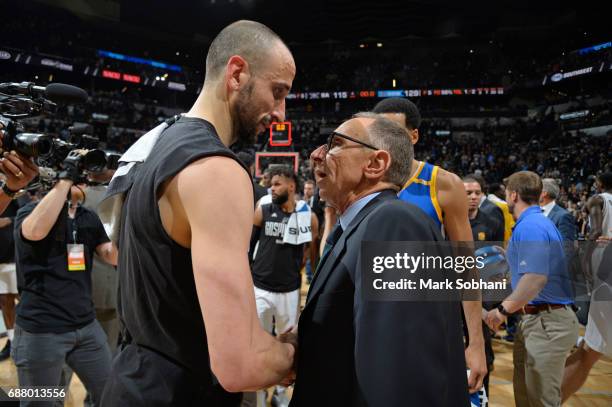 Manu Ginobili of the San Antonio Spurs and Golden State Warriors assistant head coach, Ron Adams talk after Game Four of the Western Conference...