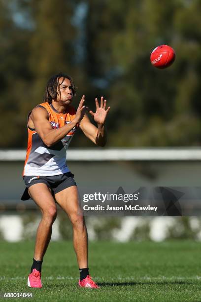 Tendai M'Zungu of the Giants catches during a Greater Western Sydney Giants AFL training session at Sydney Olympic Park Sports Centre on May 25, 2017...