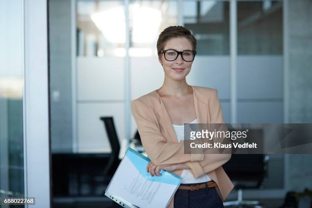 portrait of cool young business woman, in modern office - blue blazer stock pictures, royalty-free photos & images