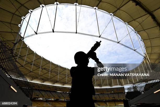 Member of the Royal Malaysian Police Special Task Force leaves after taking part in a security drill at the Bukit Jalil National Stadium in Kuala...