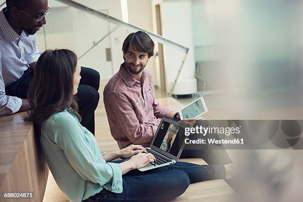 business people having a video conference on laptop - funky office stock pictures, royalty-free photos & images