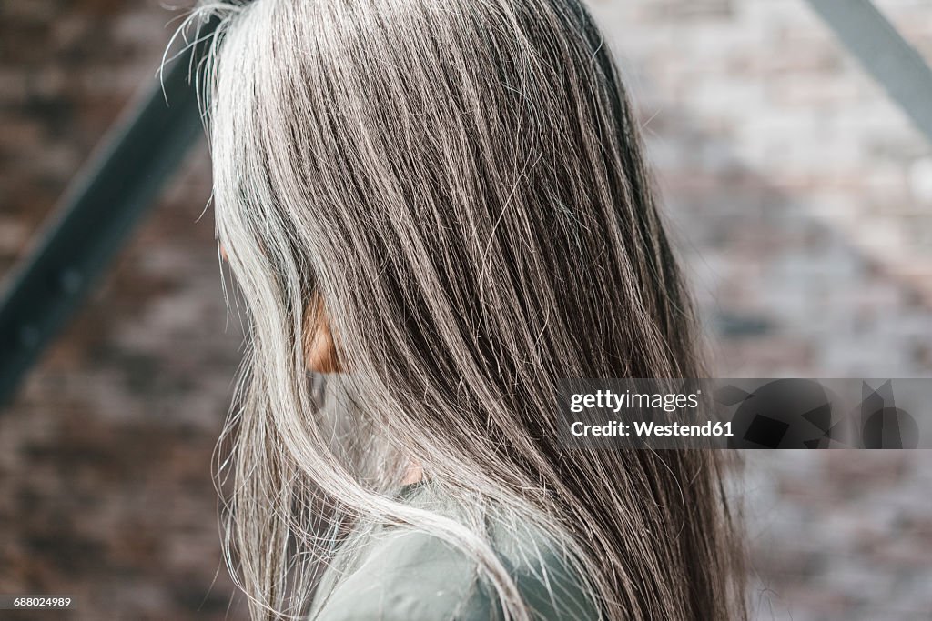 Woman with long grey hair