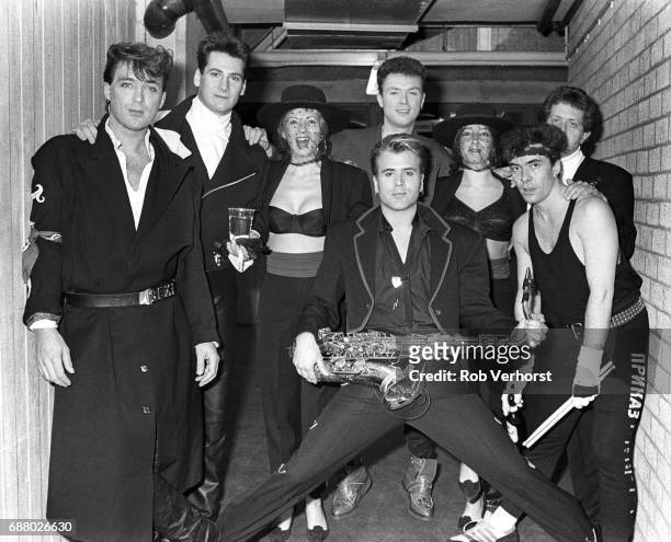 Spandau Ballet, group portrait backstage, Ahoy, Rotterdam, Netherlands, 28th February 1987. L-R Martin Kemp, Tony Hadley, unidentified, Gary Kemp ,...