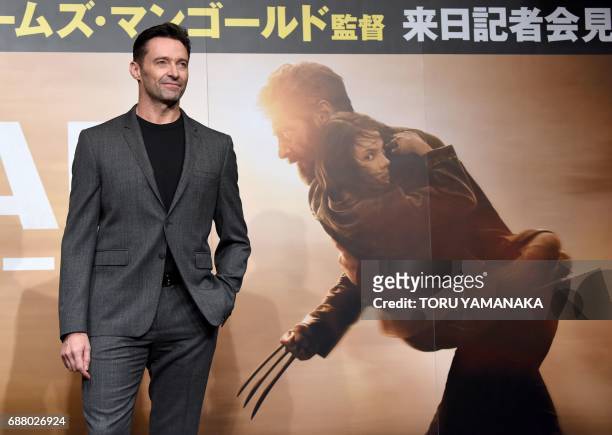 Australian actor Hugh Jackman poses for photographers during a press conference to promote his latest movie "Logan" in Tokyo on May 25, 2017. The...