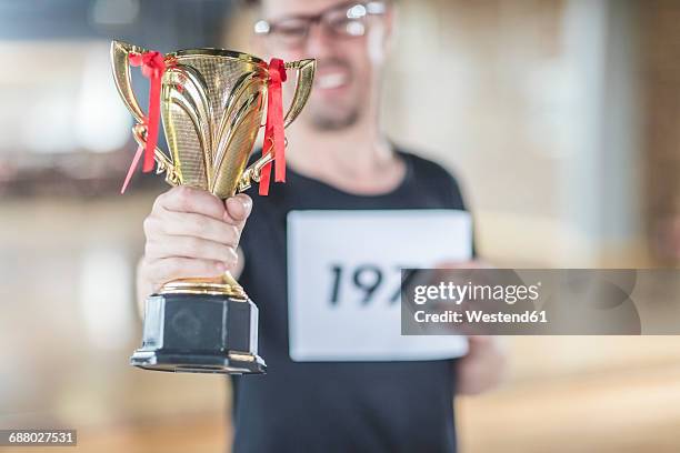 male dance winner holding trophy - honors awards 2016 show stock pictures, royalty-free photos & images