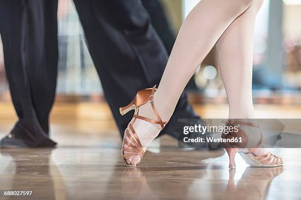 feet of dancing couple in studio - ballroom dancing feet stock pictures, royalty-free photos & images