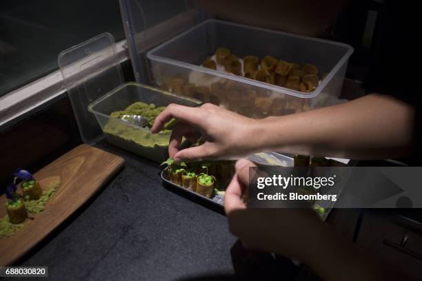 Chef prepares 'goat brain' in the kitchen of Gaggan restaurant in Bangkok, Thailand, on Thursday, May 4, 2017. After his restaurant's third straight...