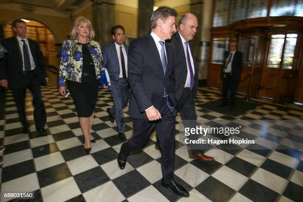 Prime Minister Bill English and Finance Minister Steven Joyce make their way to the house before the 2017 budget presentation at Parliament on May...