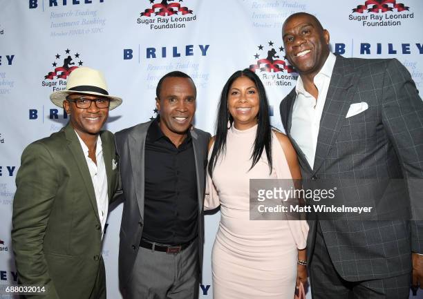 Tommy Davidson, Sugar Ray Leonard, Cookie Johnson, and Magic Johnson attend the B. Riley & Co. 8th Annual "Big Fighters, Big Cause" Charity Boxing...