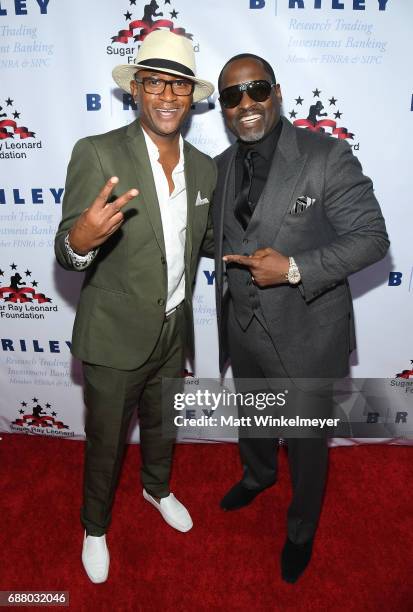 Tommy Davidson and Johnny Gill attend the B. Riley & Co. 8th Annual "Big Fighters, Big Cause" Charity Boxing Night benefiting the Sugar Ray Leonard...