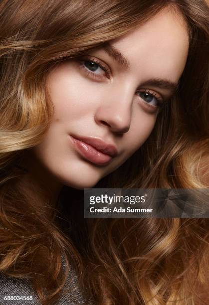 beauty shot of a young brunette with long wavy hair - glamour shot stock pictures, royalty-free photos & images