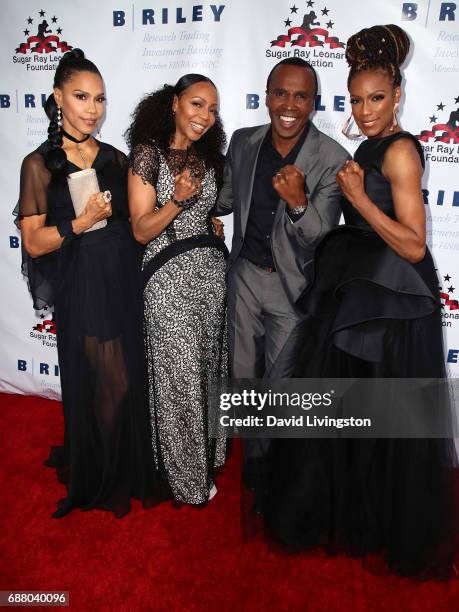 Former professional boxer Sugar Ray Leonard poses with singers Cindy Herron-Braggs, Terry Ellis and Rhona Bennett of 'En Vogue' at the 8th Annual...