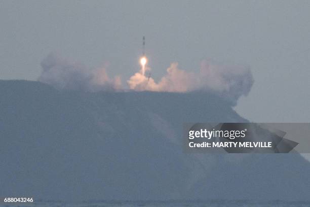 Rocket Lab's Electron rocket lifts off from its launch site in Mahia, on the east coast of New Zealand's North Island on May 25, 2017. New Zealand...