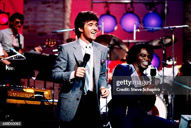 Actor and television personality Alan Thicke hosts his show 'Thicke of the Night,' with musical guest James Brown, Los Angeles, California, 1983.