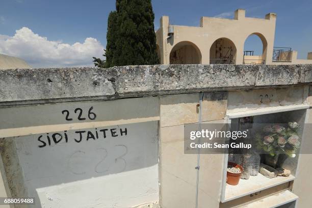 The tomb of someone identified as Sidi Jaiteh, who, according to the cemetery caretaker, is a migrant who died while trying to reach Italy, lies in a...