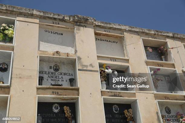 The tombs of people identified as Oussman and Jadamaalieu, who, according to the cemetery caretaker, are migrants who died while trying to reach...