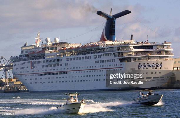 The Carnival Corp. Cruise ship Fascination sits at a slip December 17, 2001 in Miami, Florida. Setting the stage for a battle of the cruise-ship...