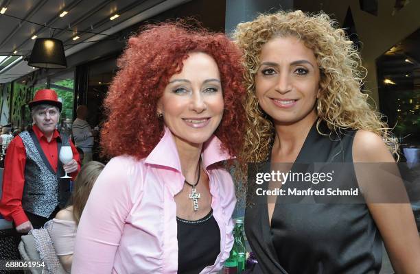 Christina Lugner and Eser Ari Akbaba pose during the 'Die Allee zum Genuss' restaurant opening party on May 24, 2017 in Vienna, Austria.