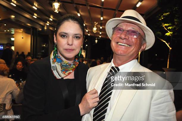Carmen Kreutzer and Louie Austen pose during the 'Die Allee zum Genuss' restaurant opening party on May 24, 2017 in Vienna, Austria.