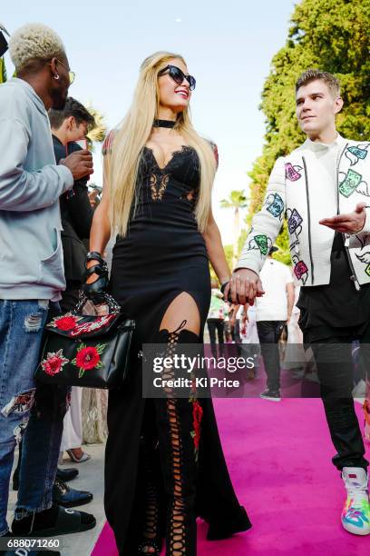 Paris Hilton with boyfriend Chris Zylka walk the runway at Philipp Plein Cruise Show 2018 during the 70th annual Cannes Film Festival at on May 24,...