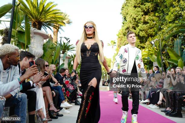 Paris Hilton with boyfriend Chris Zylka walk the runway at Philipp Plein Cruise Show 2018 during the 70th annual Cannes Film Festival at on May 24,...