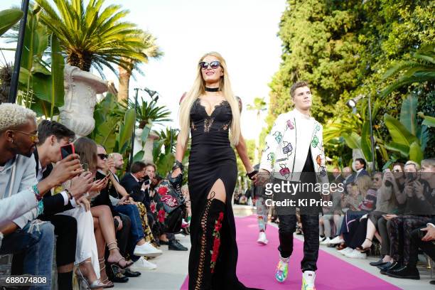 Paris Hilton with boyfriend Chris Zylka walk the runway at Philipp Plein Cruise Show 2018 during the 70th annual Cannes Film Festival at on May 24,...