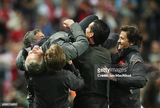 Manchester United manager Jose Mourinho is lifted up by back room staff during the UEFA Europa League Final match between Ajax and Manchester United...