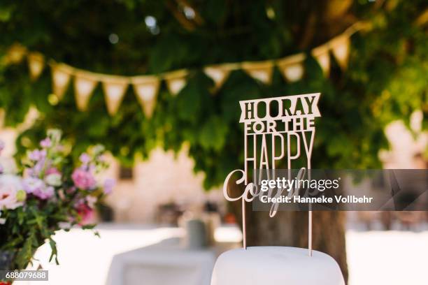 cake topper on wedding cake - wedding reception stock pictures, royalty-free photos & images