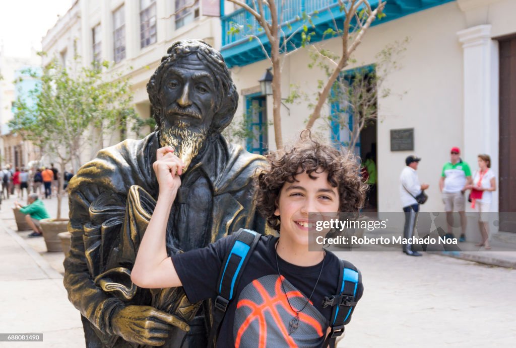 Gentleman from Paris bronze statue: Young tourist boy with...