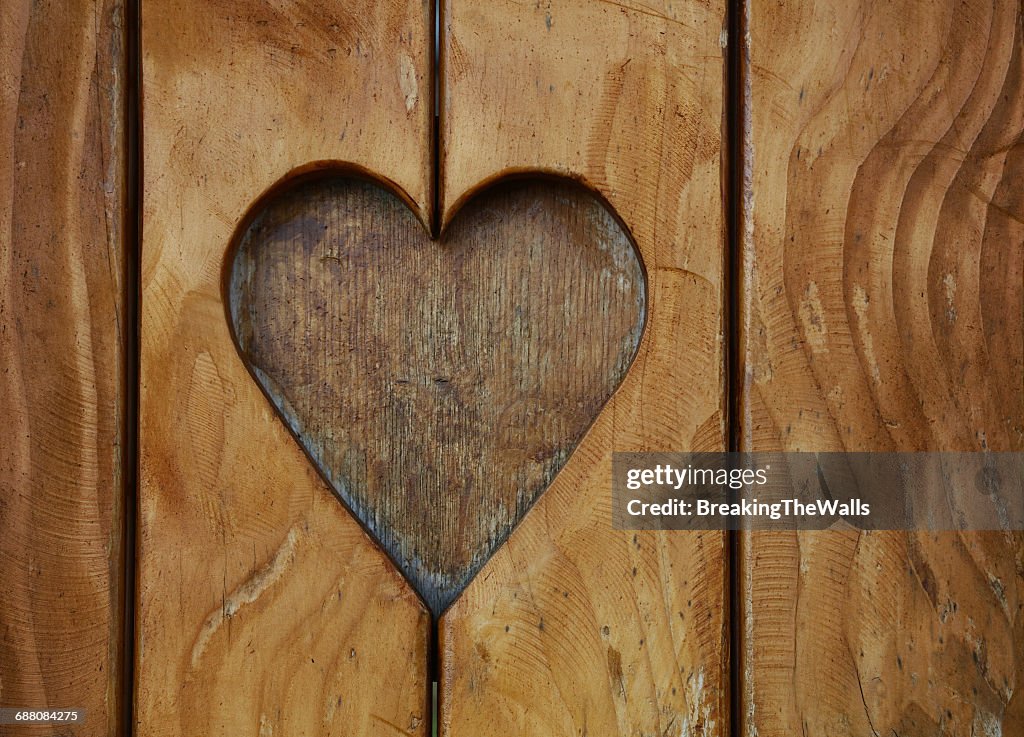 Heart Shape Carved On Wooden Plank