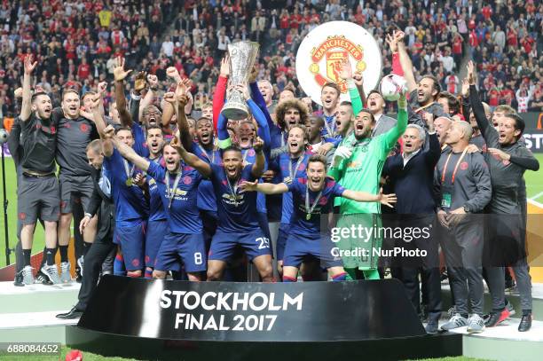 Manchester United's team celebrate with the trophy after they won the UEFA Europa League Final match between Ajax and Manchester United at Friends...