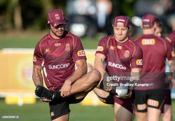 Johnathan Thurston stretches during a Queensland Maroons State of Origin training session at InterContinental Sanctuary Cove Resort Training Field on...