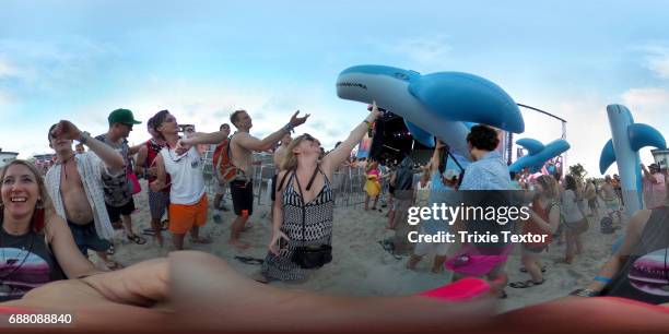 Festivalgoers and inflatable whales are seen while MGMT performs on the Hangout Stage during 2017 Hangout Music Festival on May 19, 2017 in Gulf...