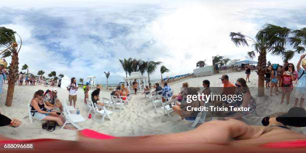 Festivalgoers kiss during their Hangout Wedding at the Wedding Chapel at the 2017 2017 Hangout Music Festival on May 20, 2017 in Gulf Shores, Alabama.