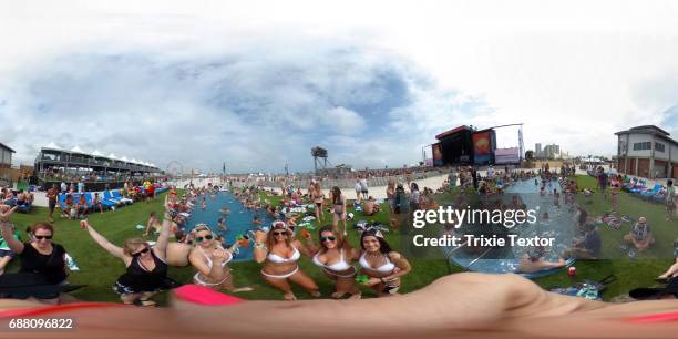 Malibu Rum girls and festivalgoers are seen in the VIP pool area during the 2017 Hangout Music Festival on May 20, 2017 in Gulf Shores, Alabama.