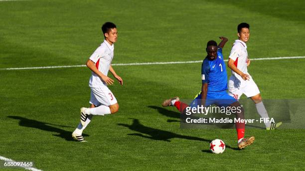 Jean-Kevin Augustin of France scores his teams third goal with pressure from Tan Sinh Huynh and Dinh Trong Tran of Vietnam during the FIFA U-20 World...