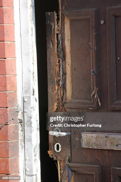 The front door of a home in Mosside where explosive damage can be seen after being raided by anti-terror police during the investigation of the...