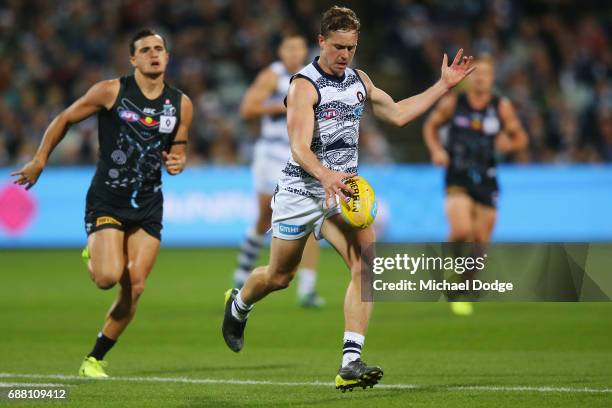 Mitch Duncan of the Cats kicks the ball during the round ten AFL match between the Geelong Cats and the Port Adelaide Power at Simonds Stadium on May...