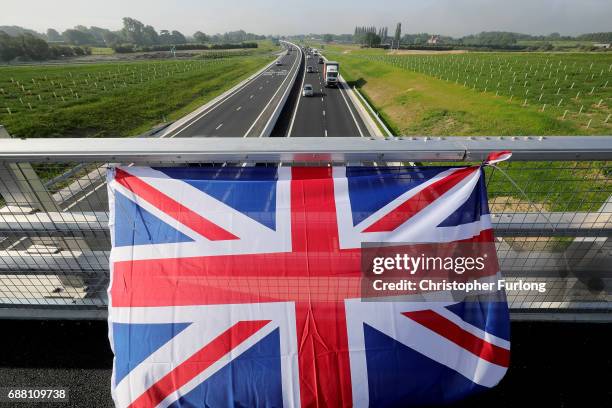 Union flag, in honour of the Manchester attack victims, flies from a motorway bridge as communters make their way into Manchester on May 25, 2017 in...