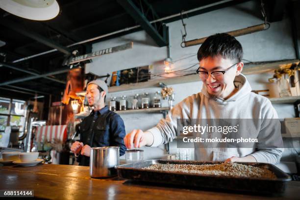 two young men's cafe owners of confident - 静かな情景 stock pictures, royalty-free photos & images