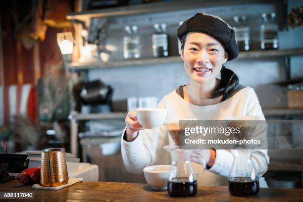 happy japanese woman cafe owner - くつろぐ stock pictures, royalty-free photos & images