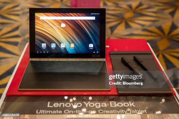 Lenovo Group Ltd. Yoga Book tablet device sits on display during a news conference in Hong Kong, China, on Thursday, May 25, 2017. Lenovo's quarterly...