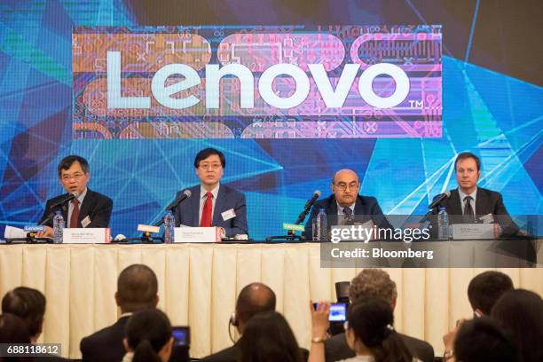 Wong Wai Ming, executive vice president and chief financial officer of Lenovo Group Ltd., from left, Yang Yuanqing, chairman and chief executive...