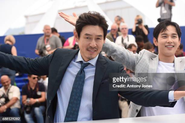 Actors Kyoung-gu Sul and Yim Si-wan attend the "The Merciless" photocall during the 70th annual Cannes Film Festival at Palais des Festivals on May...