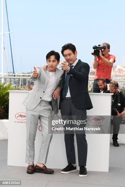 Actors Yim Si-wan and Kyoung-gu Sul attend the "The Merciless" photocall during the 70th annual Cannes Film Festival at Palais des Festivals on May...