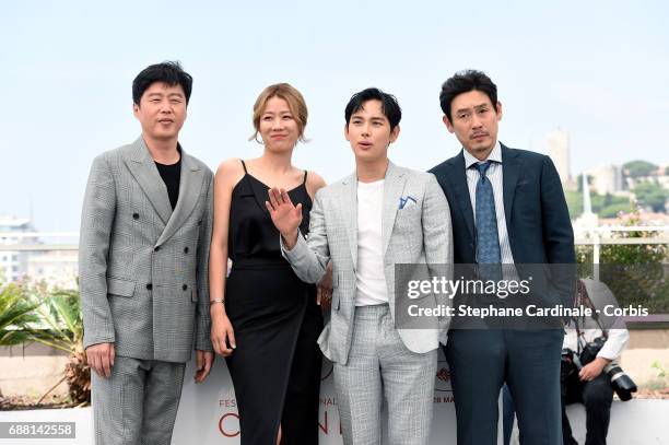 Actors Kim Hee-won, Hye-Jin Jeon, Yim Si-wan and Kyoung-gu Sul attends the "The Merciless" photocall during the 70th annual Cannes Film Festival at...