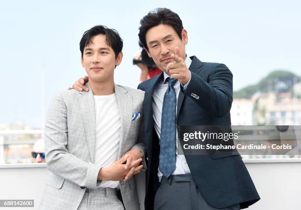 Actors Yim Si-wan and Kyoung-gu Sul attend the "The Merciless" photocall during the 70th annual Cannes Film Festival at Palais des Festivals on May...